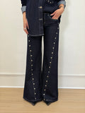 Jeans con borchie